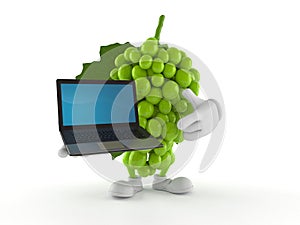 Grapes character holding laptop