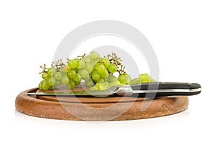 grapes green on chopping board isolated on white background