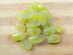 Grapes heap on wooden background