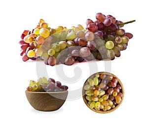 Grapes Kishmish isolated on white background. Top view. Bunch of grapes and berries in a bowl isolated on white. Pink grapes Kishm