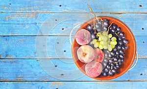 Grapes and peaches, flat lay on a rustic table, good copy s