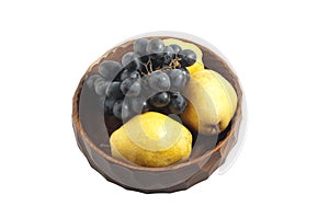 Grapes and pears in the wooden bowl
