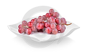 Grapes in the plate on white background