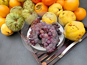 Grapes and autumn fruits in a table