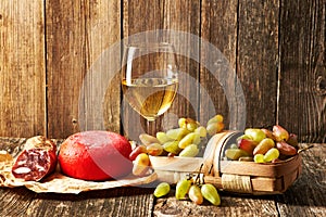 Grapes, white wine and cheese