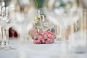 Grapes and wine glasses on the table