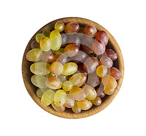Grapes in a wooden bowl isolated on white background
