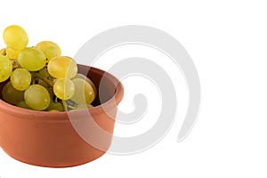 Grapes in wooden plate on white background