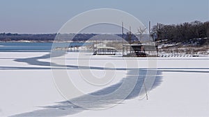 Grapevine lake in Grapevine Texas with snow and ice.