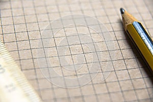 Graph paper of notebook background, blank page of retro sketchbook with old pencil and ruler