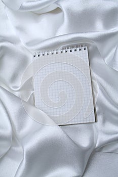 Graph paper on white silk