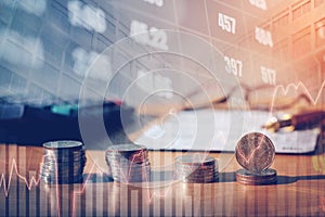 Graph on rows of coins for finance and banking on digital stock