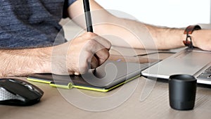 Graphic artist working on a digital tablet