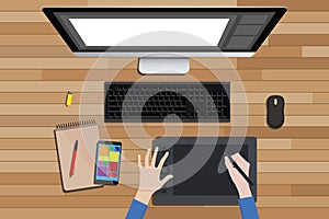 Graphic design workspace with digital sketching and monitor