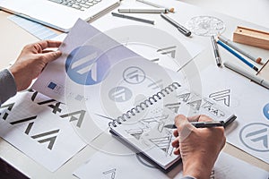 Graphic designer development process drawing sketch design creative Ideas draft Logo product trademark label brand artwork.
