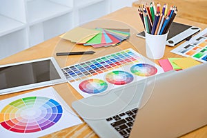 Graphic designer object tool and color swatch samples at workspace