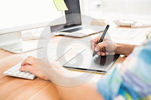 Graphic designer using computer and digitizer