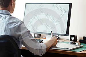 Graphic designer using digital tablet and computer