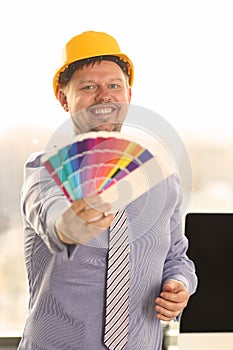 Graphic Designer Work on Project with Color Chart