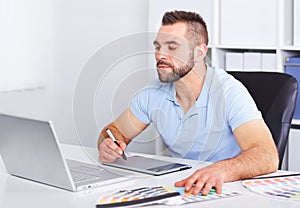 Graphic designer working on digital tablet