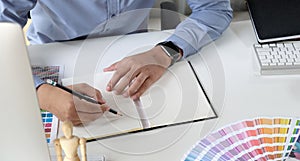 Graphic designer working with drawing tablet