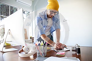 Graphic Designer working with interactive pen display, digital Drawing tablet and Pen on a computer.