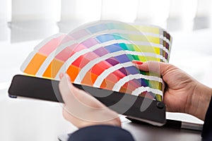 Graphic designer working with pantone palette