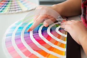 Graphic designer working with pantone palette