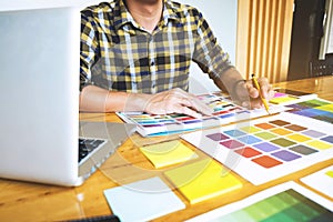 Graphic designers choose colors from the color bands samples for