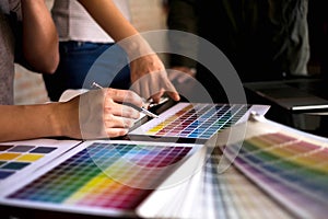 Graphic designers choose colors from the color bands samples for design .Designer graphic creativity work concept