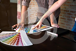 Graphic designers choose colors from the color bands samples for design .Designer graphic creativity work concept