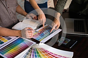 Graphic designers choose colors from the color bands samples for design .Designer graphic creativity work concept