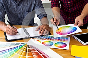 Graphic designers choose colors from the color bands samples for design .Designer graphic creativity work concept