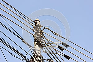 Graphic lines of powers cables with light blue sky