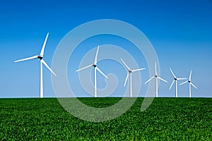 Graphic modern landscape of wind turbines aligned in a field