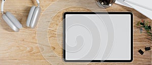Graphic tablet blank screen mockup on wood office working desk