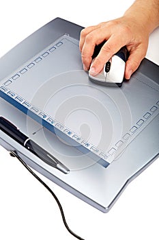 Graphic tablet with mouse and pen on a white background