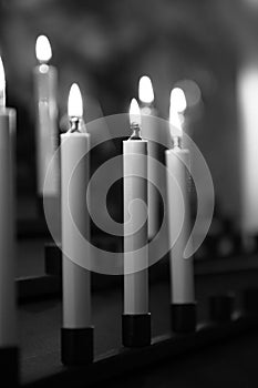 A graphical view of closeup of candles, Rupert Mayer Church Unterkirche in Citizen`s Hall Church BÃ¼rgersaalkirche Munich MÃ¼nc