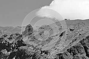 A graphical view of a group of tourists on the steep and dangerous track circling volcano cone of Mount Vesuvius Monte Vesuvio,