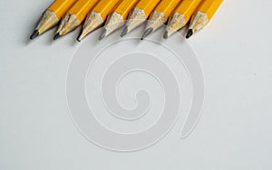 Graphite pencils on white paper. photo