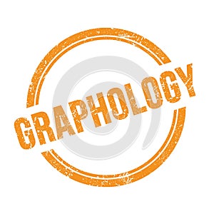 GRAPHOLOGY text written on orange grungy round stamp