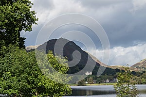 Grasmere, Cumbria, Lake and village, overlooked by Helm Crag photo