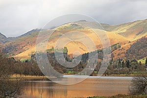 Sun Shining over Grasmere Lake and Fells, Lake District, Cumbria, England, UK