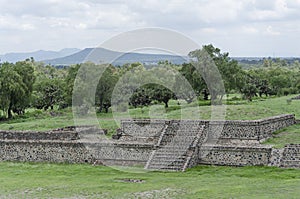 Grass-covered Pre-Hispanic Mesoamerican platforms in Teotihuacan, Mexico photo