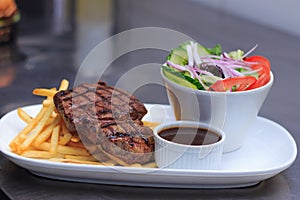 Grass Fed Rump Steak with chips salad and pepper sauce