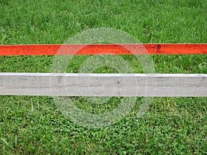 Grass field with red demarcation