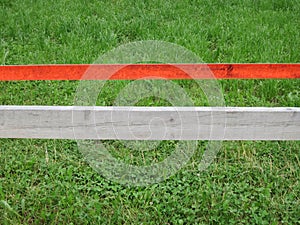 Grass field with red demarcation photo