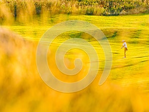 Woman playing golf