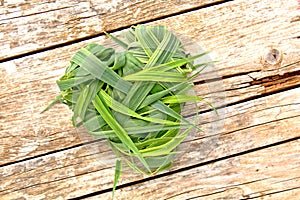 Grass heart on wood