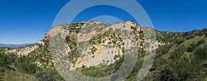 Grass Hillside and Rock Canyons